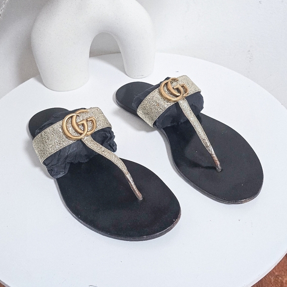 Gucci Shoes - Gucci GG logo black and metallic gold thong flat sandals